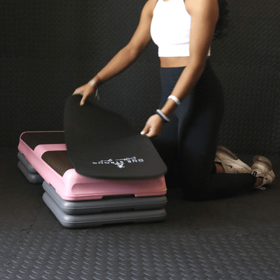 pink aerobic step with 4 risers and mat
